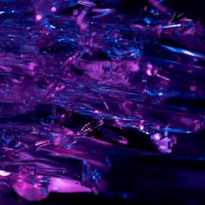 Stunning macro shot of purple and blue crystals, revealing intricate textures and vibrant colors.